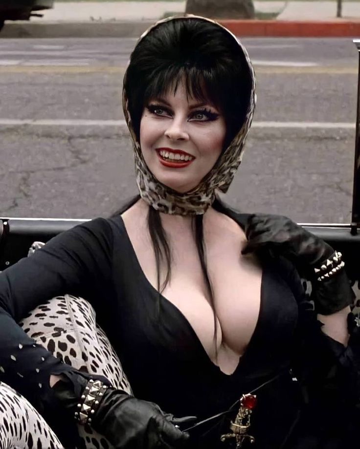 Elvira Breasts mouth gangbang